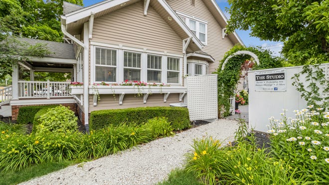 This Indianola Craftsman home with a business sold for $725,000